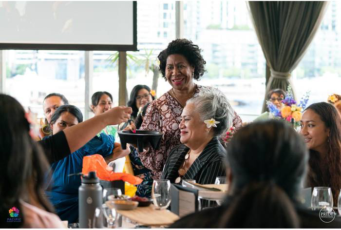 A person addresses guests at a PBN event